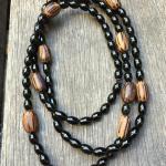 Long collier perles onyx noir et palmier
